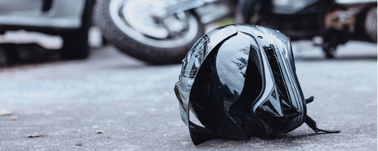 Motorcycle helmet laying on ground after a crash